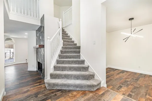 a view of staircase with white walls