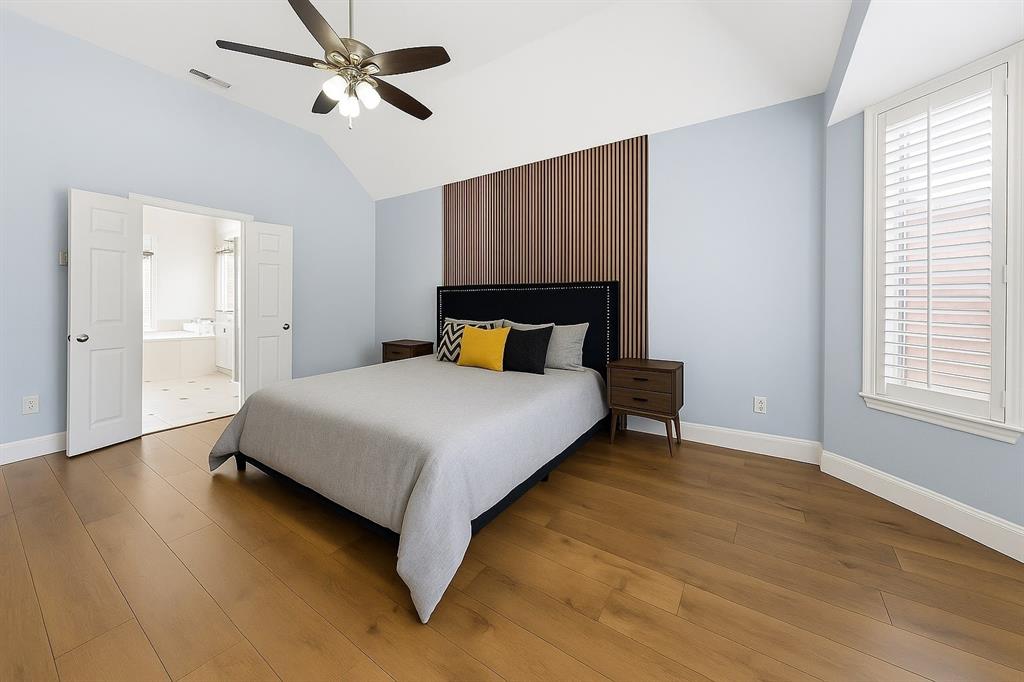 7913 Morningdew Drive Plano, TX 75025 - Photo 27 of 40 a bedroom with a bed and wooden floor