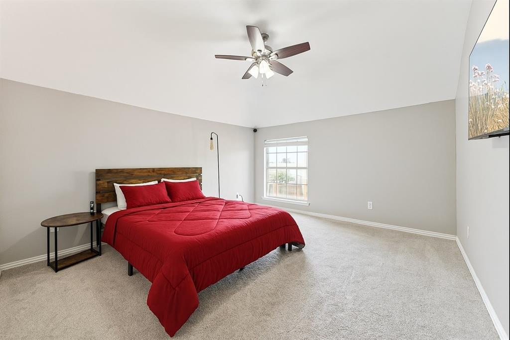 7913 Morningdew Drive Plano, TX 75025 - Photo 29 of 40 a bedroom with a bed and window