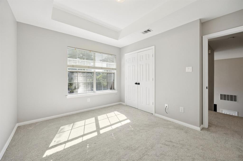 7913 Morningdew Drive Plano, TX 75025 - Photo 34 of 40 an empty room with windows and closet