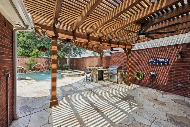 a view of a backyard with sitting area