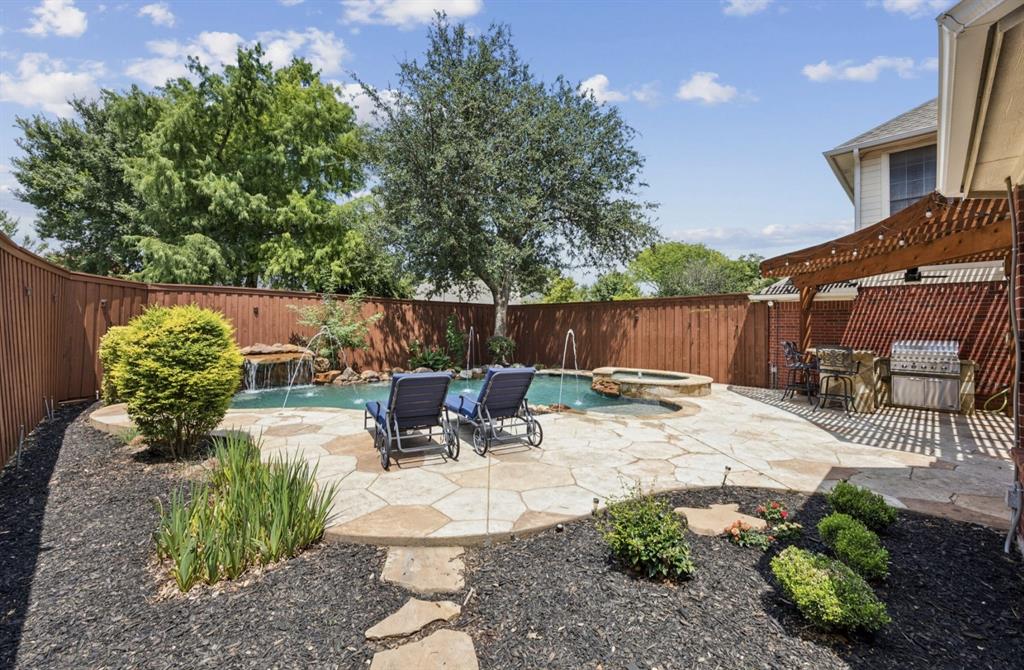 7913 Morningdew Drive Plano, TX 75025 - Photo 4 of 40 a view of backyard with outdoor seating and plants