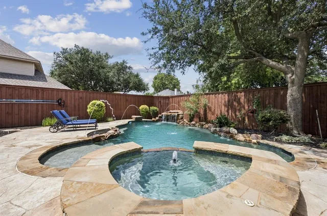 a view of a swimming pool with a patio