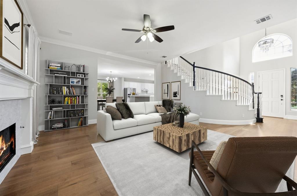 7913 Morningdew Drive Plano, TX 75025 - Photo 7 of 40 a living room with furniture or couch and a bookshelf