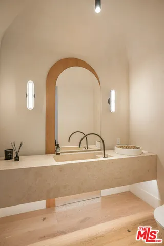 a view of bathroom with a shower and a door