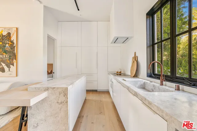 a view of a swimming pool with an outdoor space and seating area