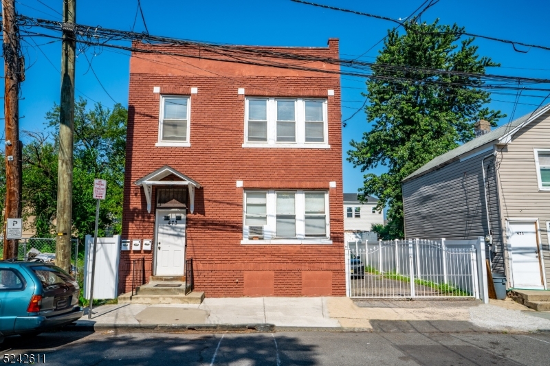 473 South 16th Street, Unit 2 Newark, NJ 07103 - Photo 1 of 15 a front view of a house with a garden