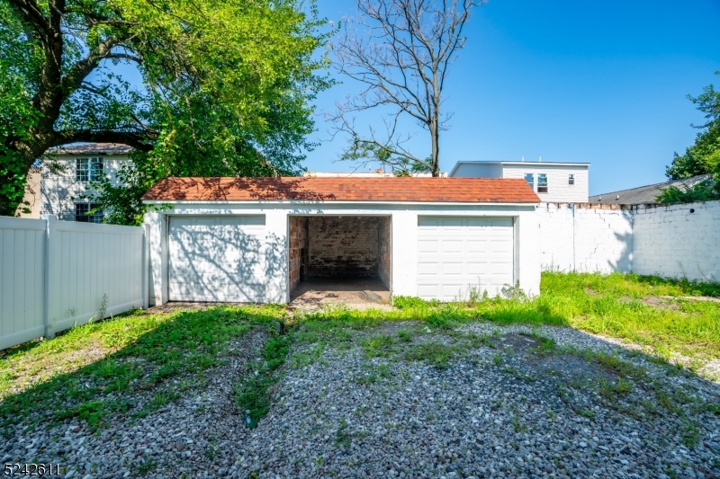 473 South 16th Street, Unit 2 Newark, NJ 07103 - Photo 15 of 15 a view of a house with a yard and tree