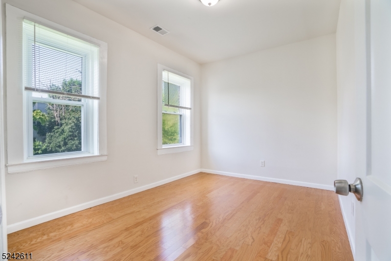 473 South 16th Street, Unit 2 Newark, NJ 07103 - Photo 7 of 15 an empty room with a window