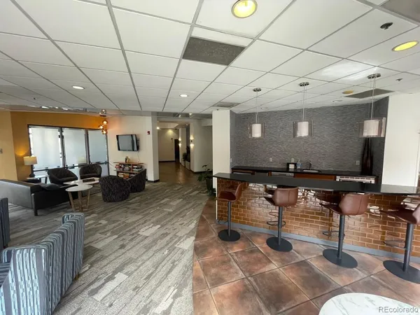 a living room with lots of furniture and a flat screen tv