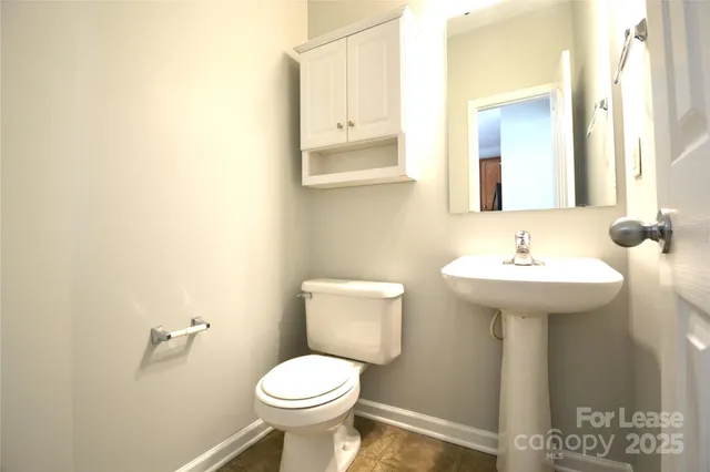 a kitchen with a stove a sink and a refrigerator