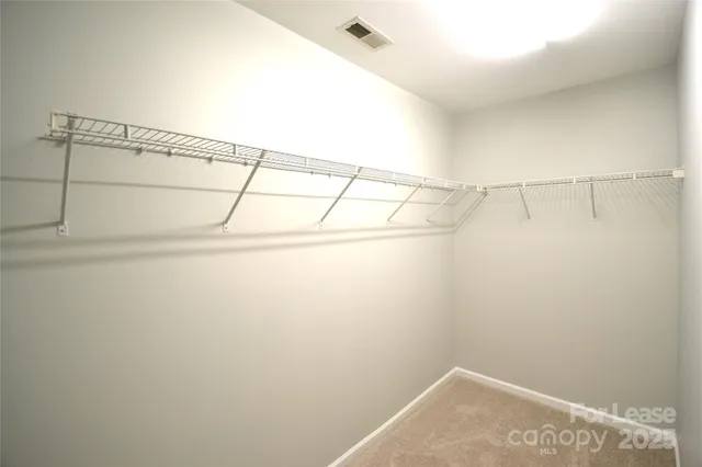 a view of bathroom with a tub shower and mirror