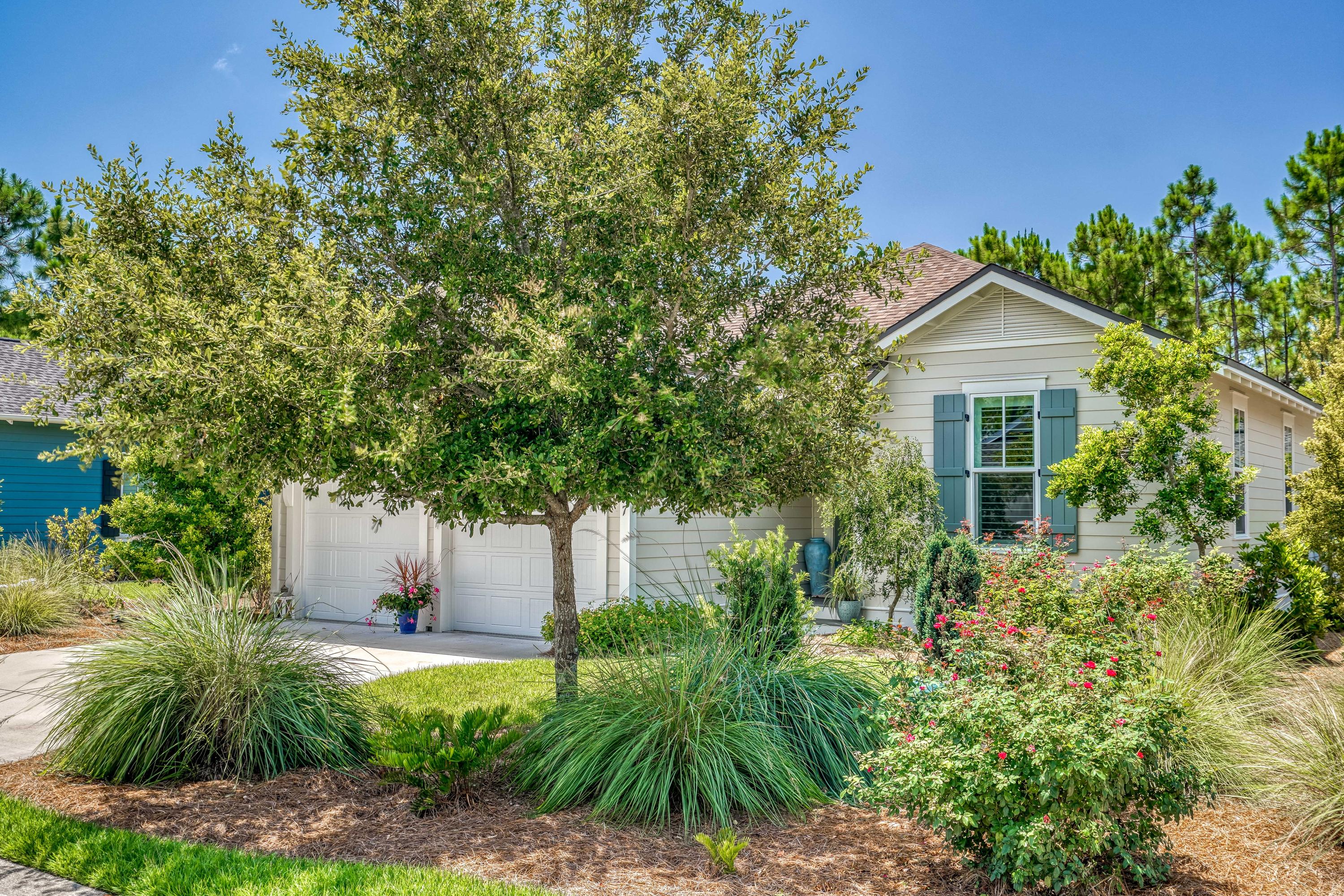 137 Jack Knife Drive Inlet Beach, FL 32461 - Photo 2 of 45 a front view of a house with a garden