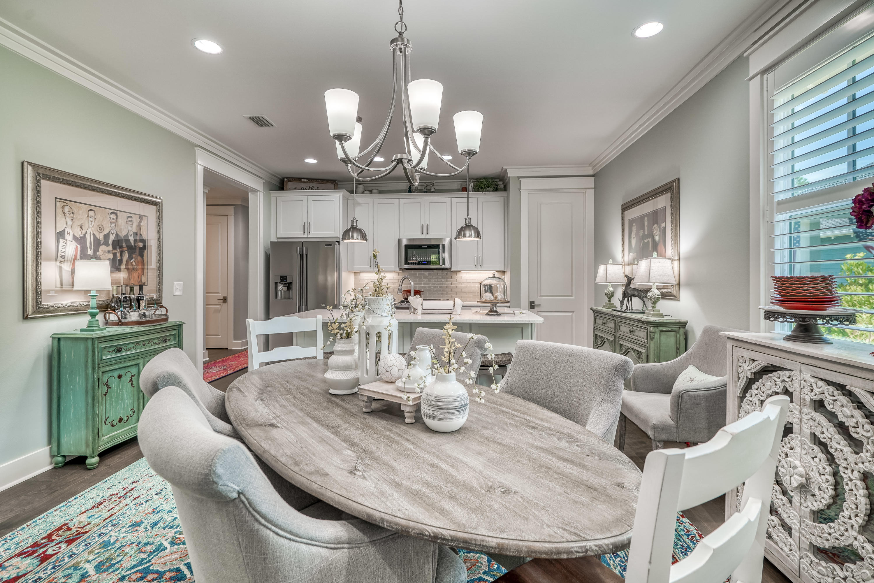 137 Jack Knife Drive Inlet Beach, FL 32461 - Photo 31 of 45 a view of a dining room with furniture a chandelier and wooden floor