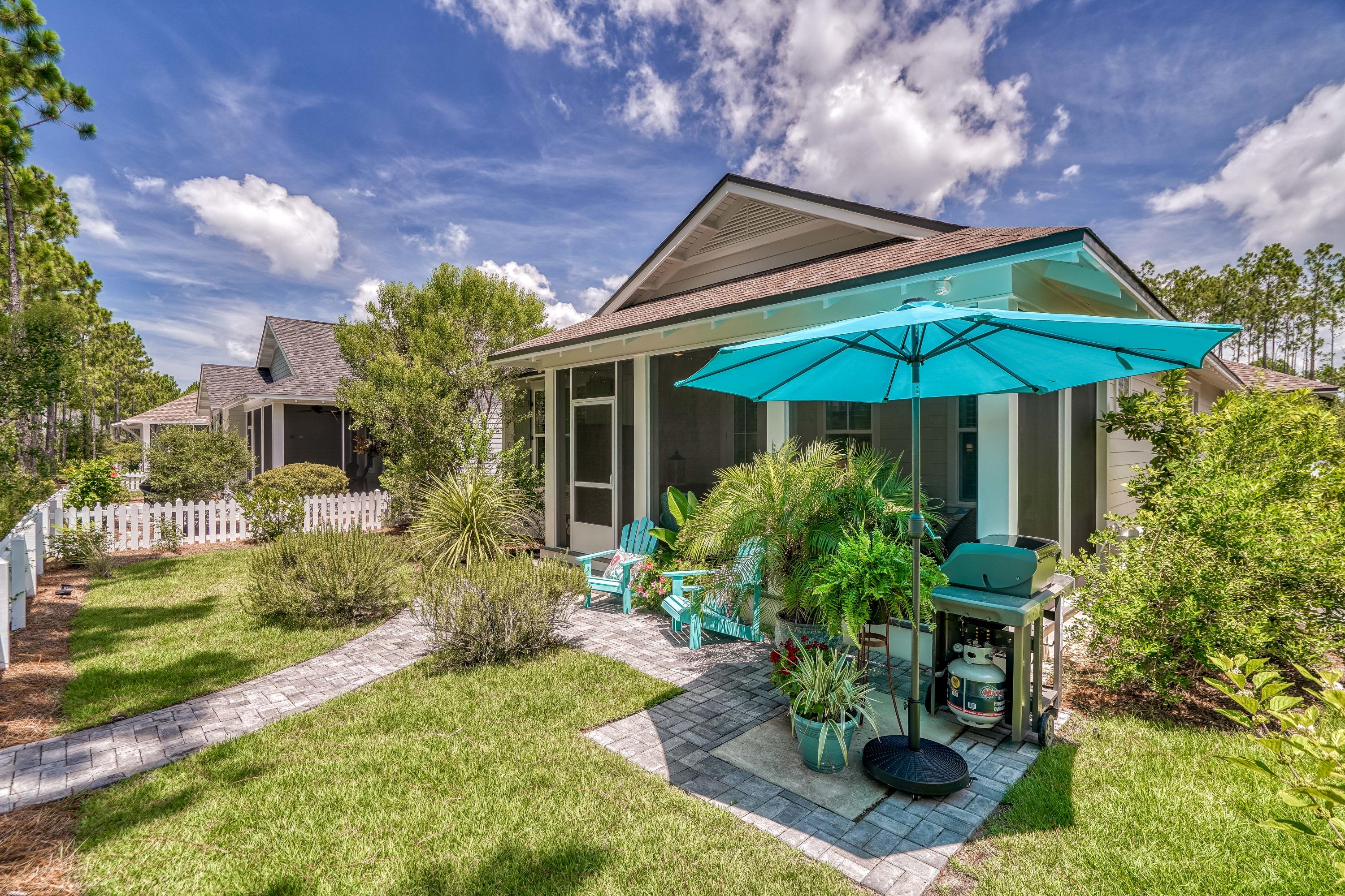 137 Jack Knife Drive Inlet Beach, FL 32461 - Photo 5 of 45 a view of a house with sitting area and garden