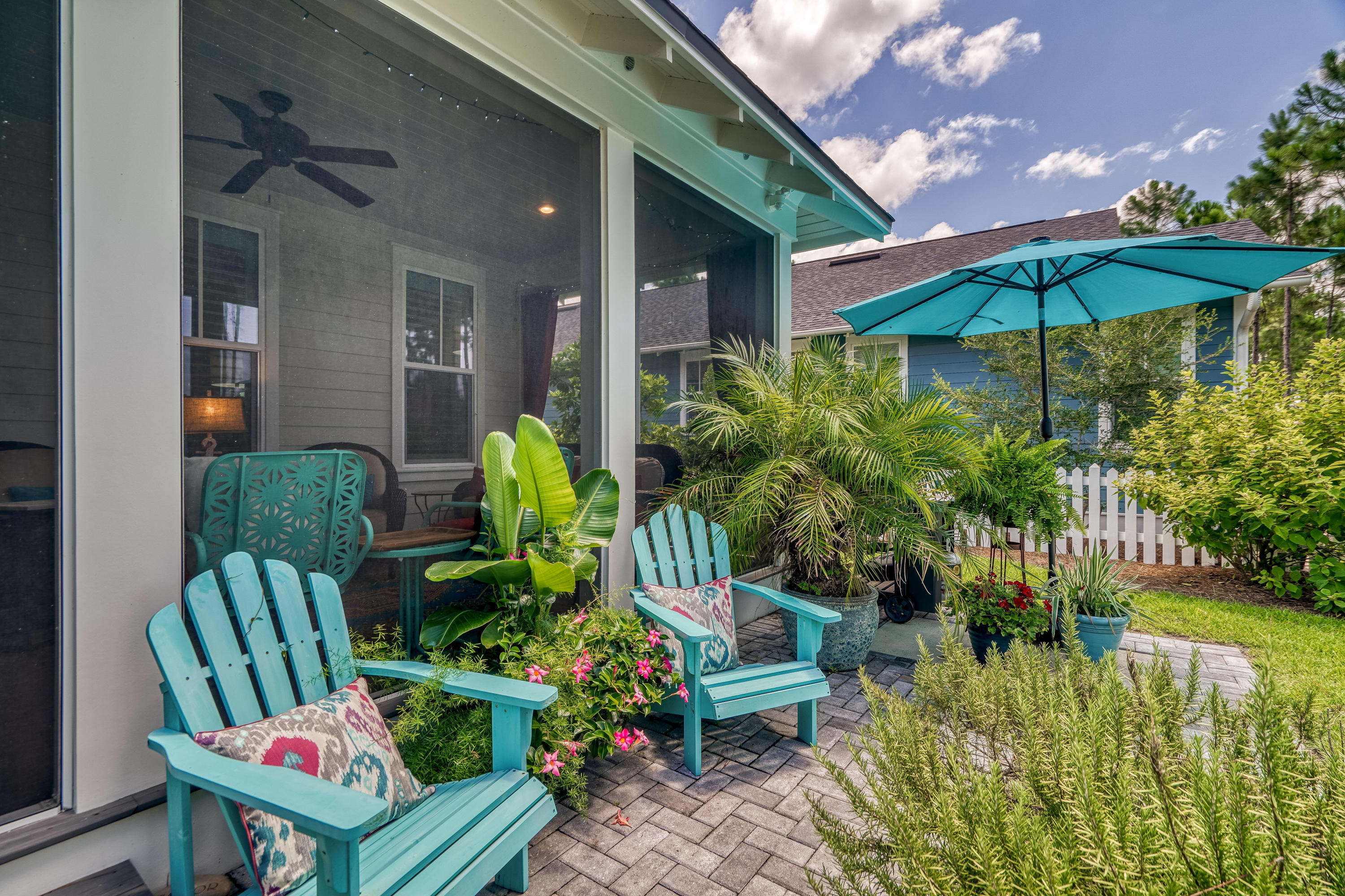 137 Jack Knife Drive Inlet Beach, FL 32461 - Photo 6 of 45 a view of a chair and tables in the patio with potted plants