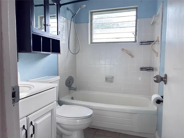 a bathroom with a sink a toilet and a bathtub