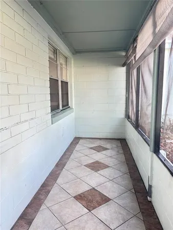 a view of empty room with windows