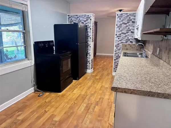 a bedroom with a bed and dresser