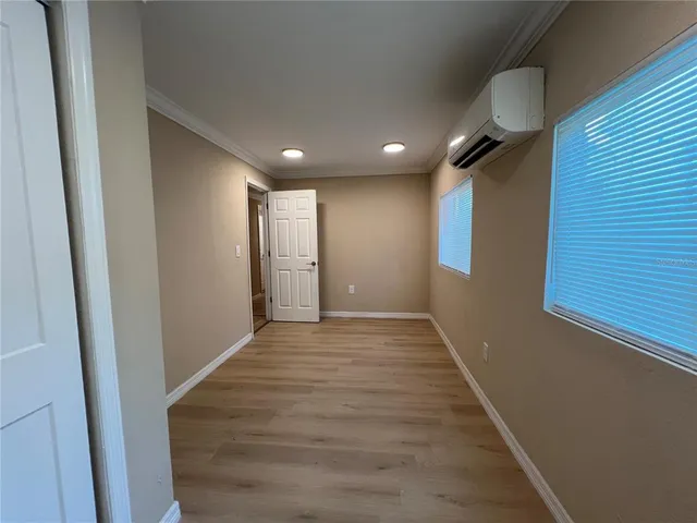 a view of hallway with wooden floor