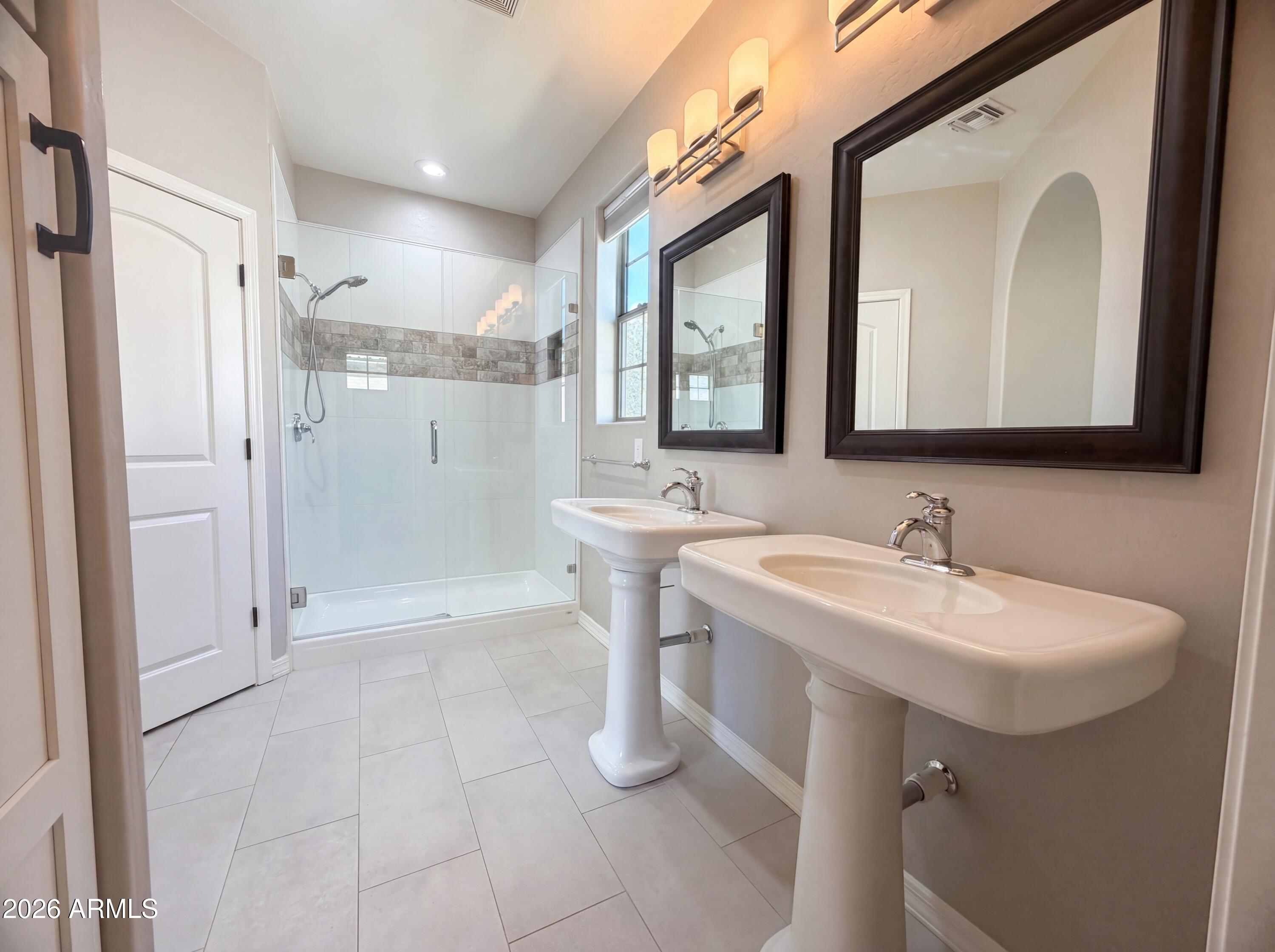 1729 South Desert View Place Apache Junction, AZ 85120 - Photo 11 of 17 a bathroom with a sink a toilet a mirror and shower