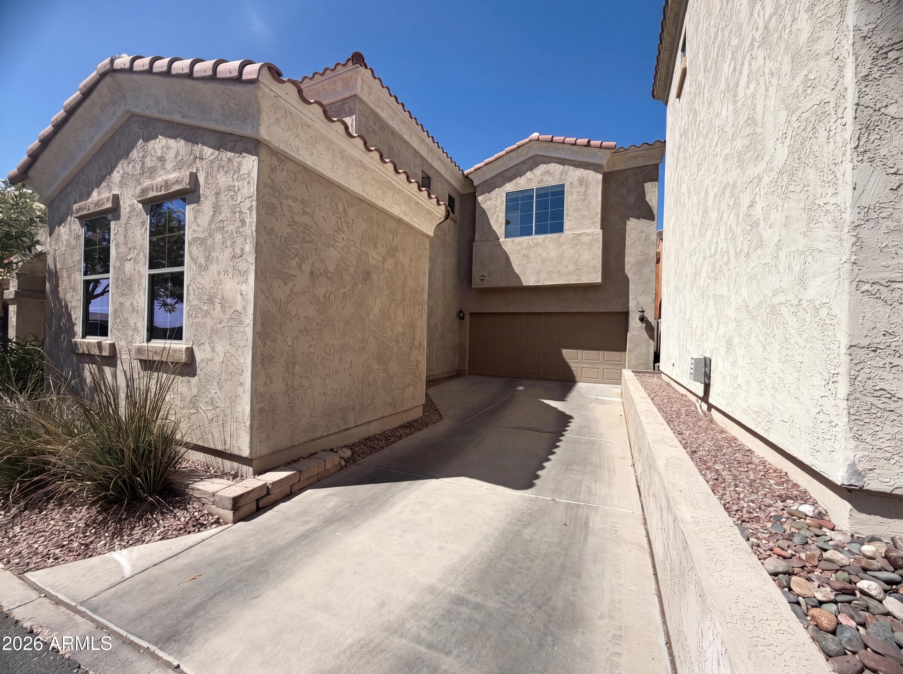 1729 South Desert View Place Apache Junction, AZ 85120 - Photo 12 of 17 a front view of a house with a yard