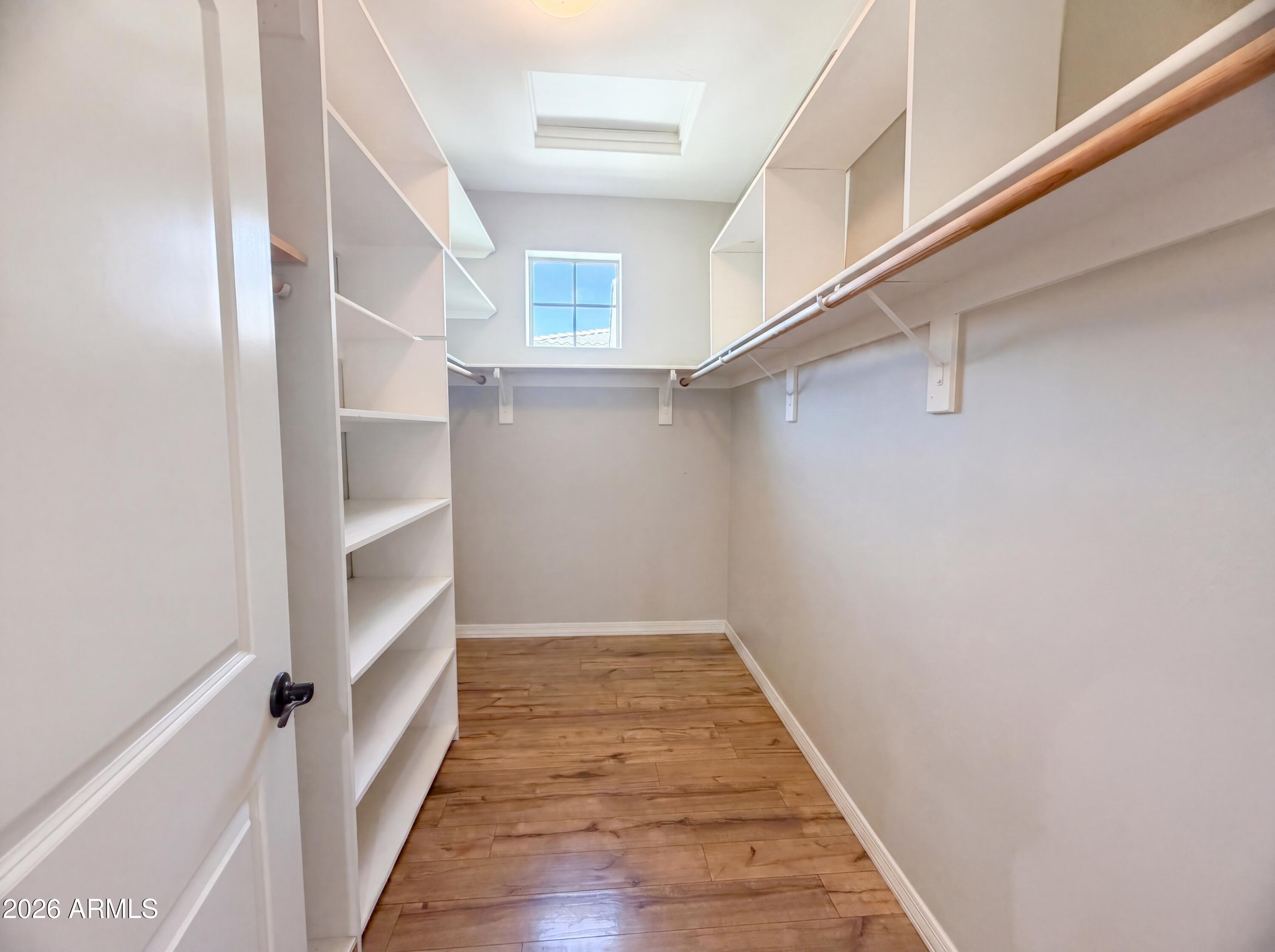 1729 South Desert View Place Apache Junction, AZ 85120 - Photo 13 of 17 a view of a hallway with wooden floor and staircase