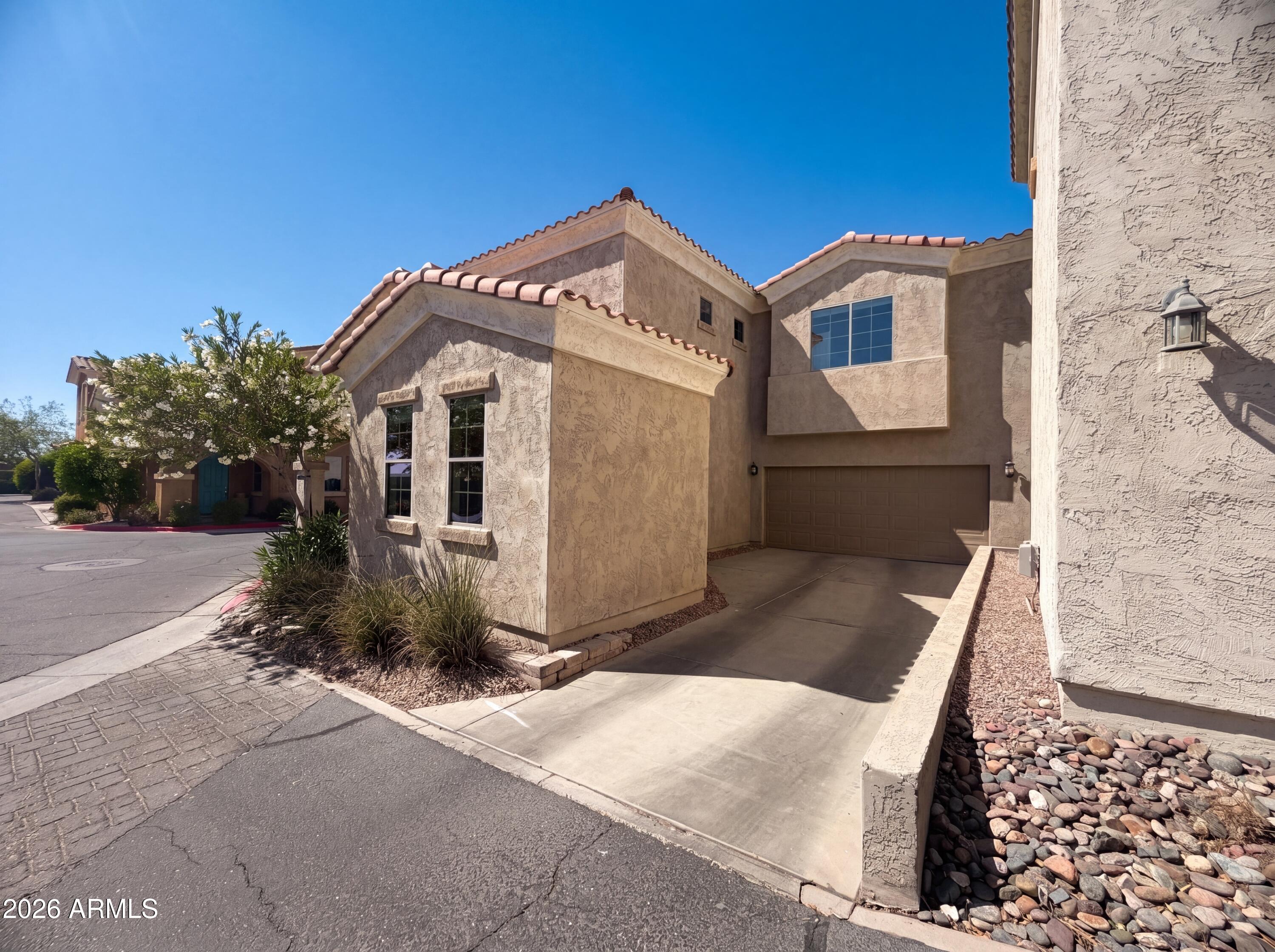 1729 South Desert View Place Apache Junction, AZ 85120 - Photo 15 of 17 a front view of a house with a yard