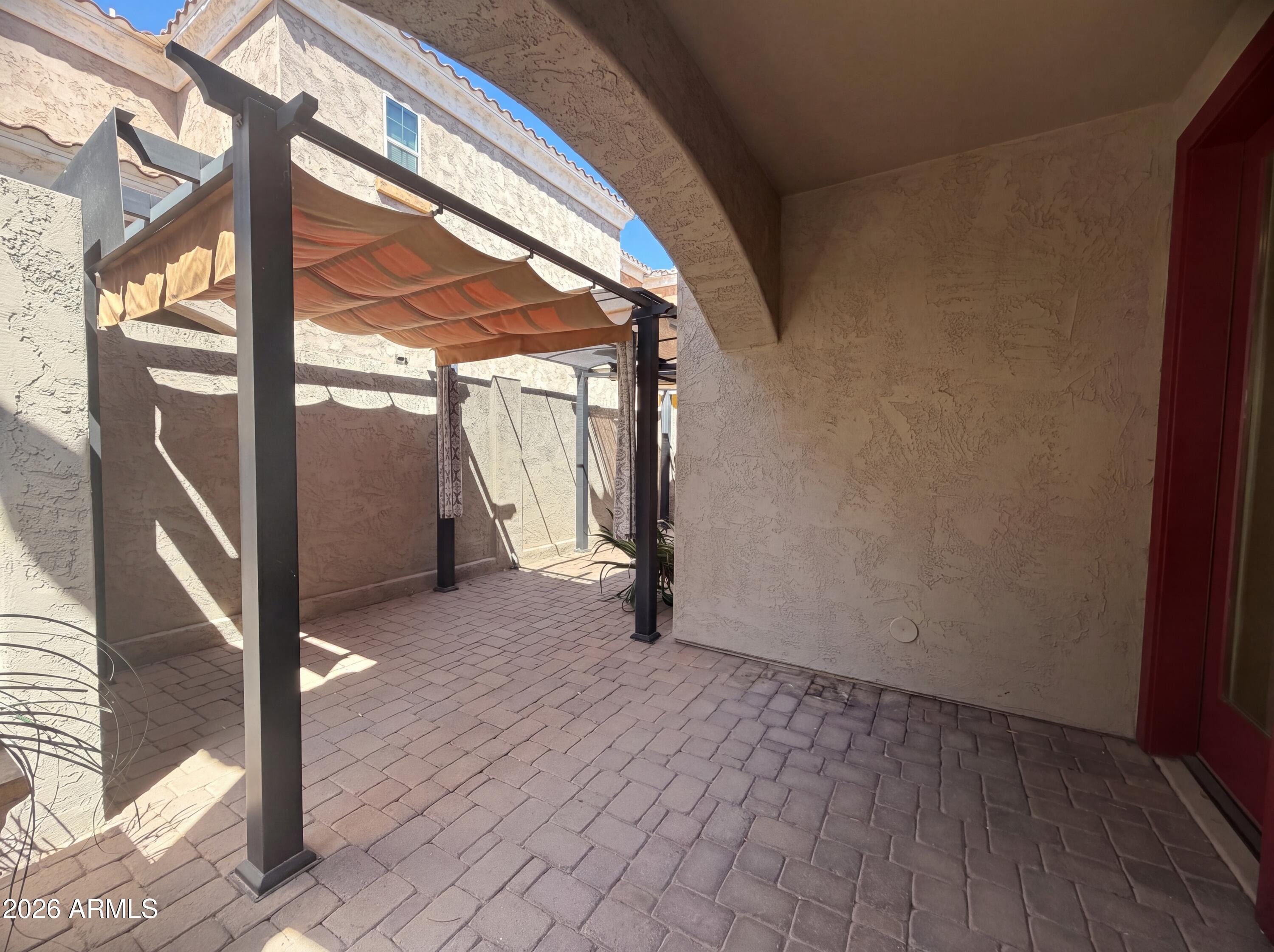 1729 South Desert View Place Apache Junction, AZ 85120 - Photo 5 of 17 a view of an empty room with wooden floor and a window