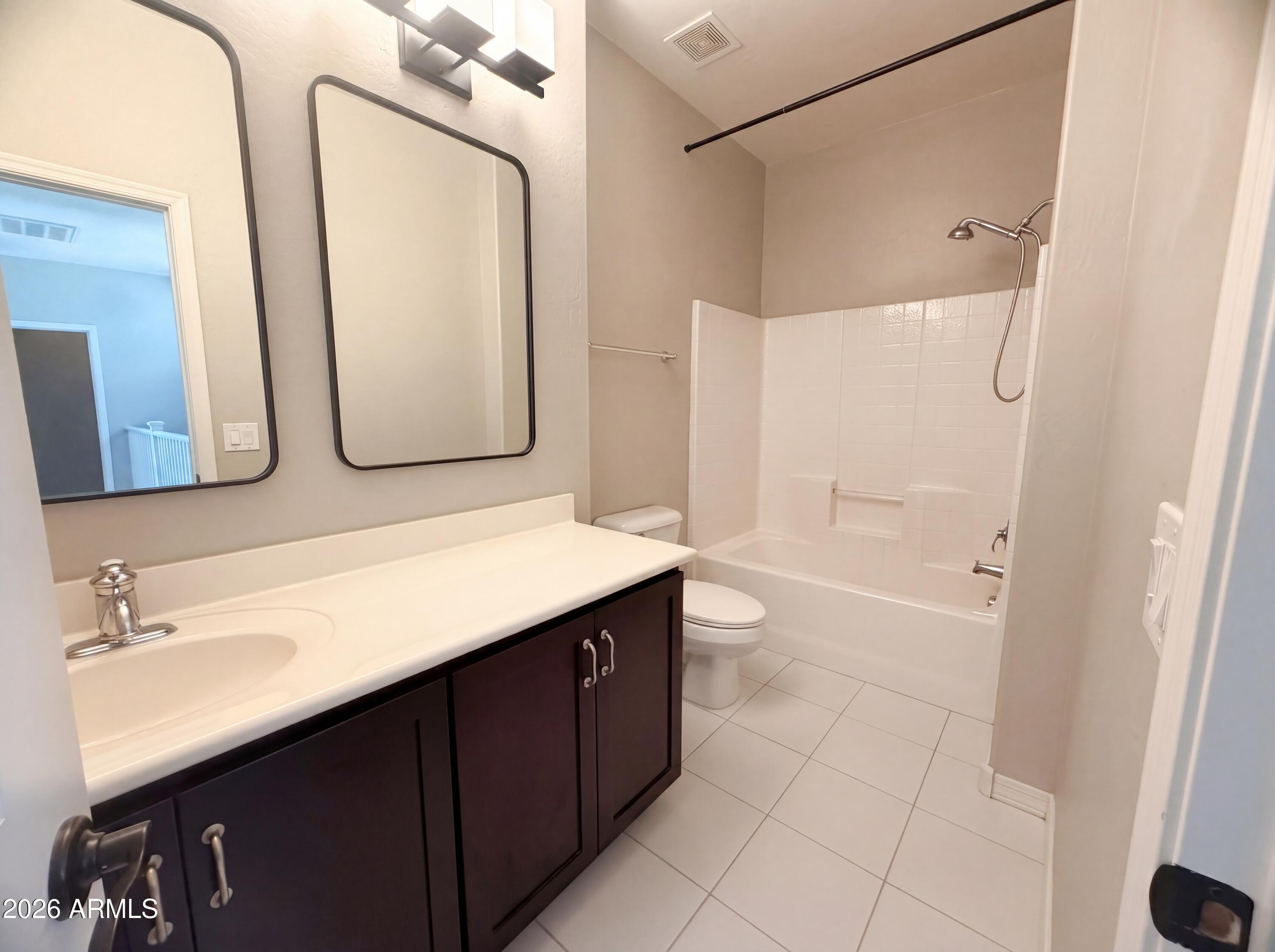 1729 South Desert View Place Apache Junction, AZ 85120 - Photo 6 of 17 a bathroom with a double vanity sink mirror and bathtub
