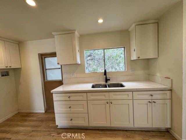 218 Park Way Bodfish, CA 93205 - Photo 5 of 13 a kitchen with white cabinets and sink