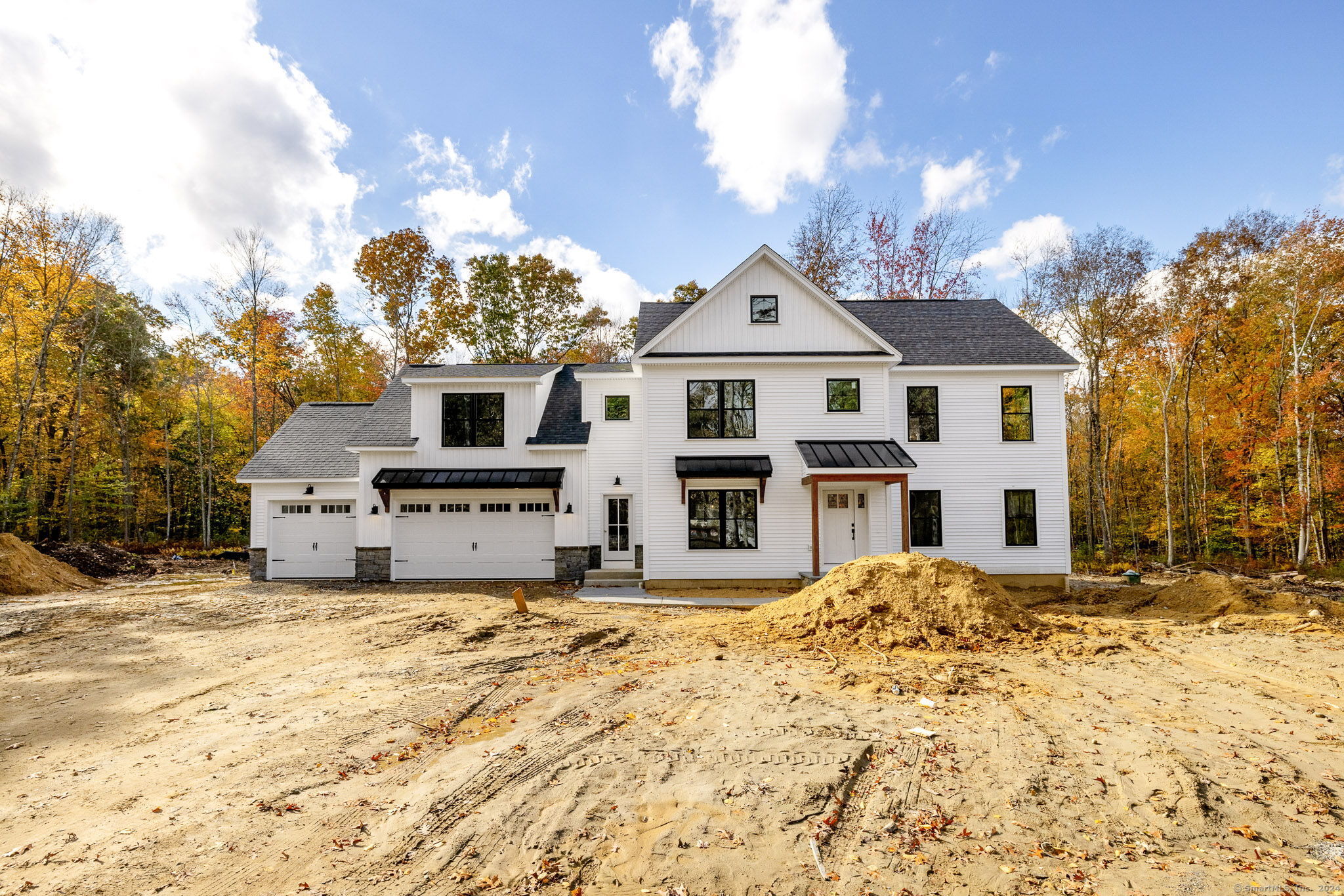 208 Chestnut Hill Road Colchester, CT 06415 - Photo 1 of 1 a large white house with a large tree in front of it