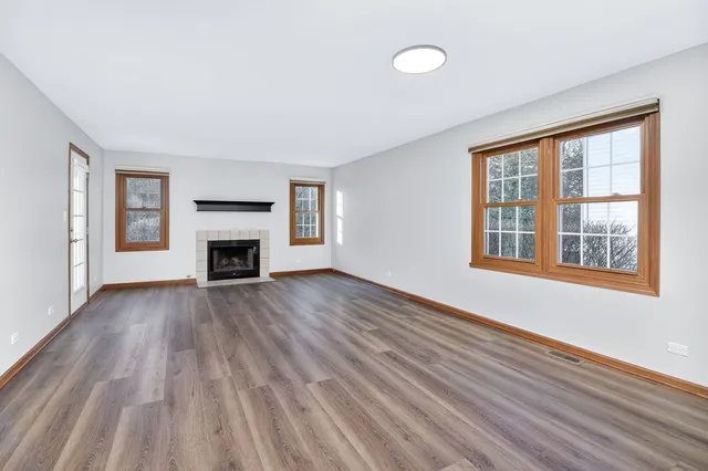 a view of main area window wooden floor and front door