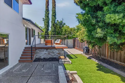 a view of yard with patio