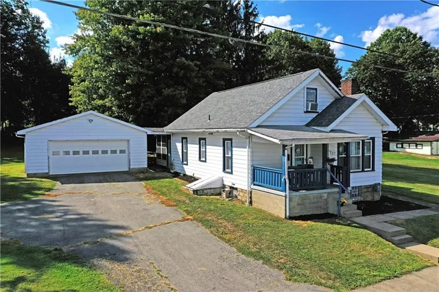 a view of a house with a yard patio and wooden floor