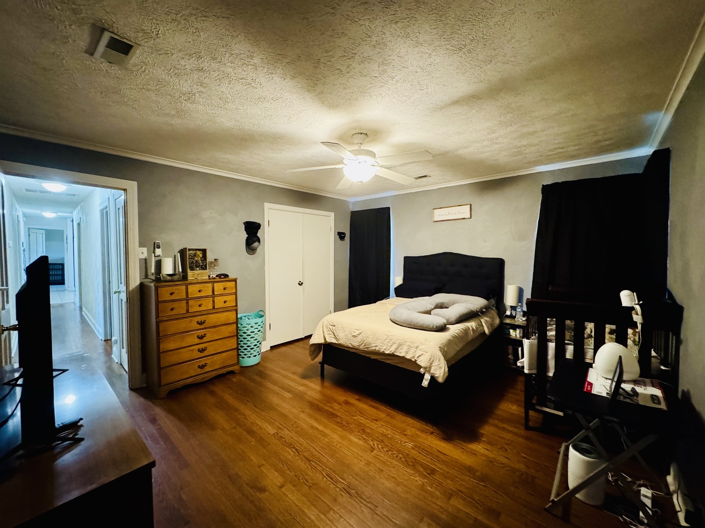 203 West Callie Street Sesser, IL 62884 - Photo 17 of 27 a bedroom with a bed and wooden floor