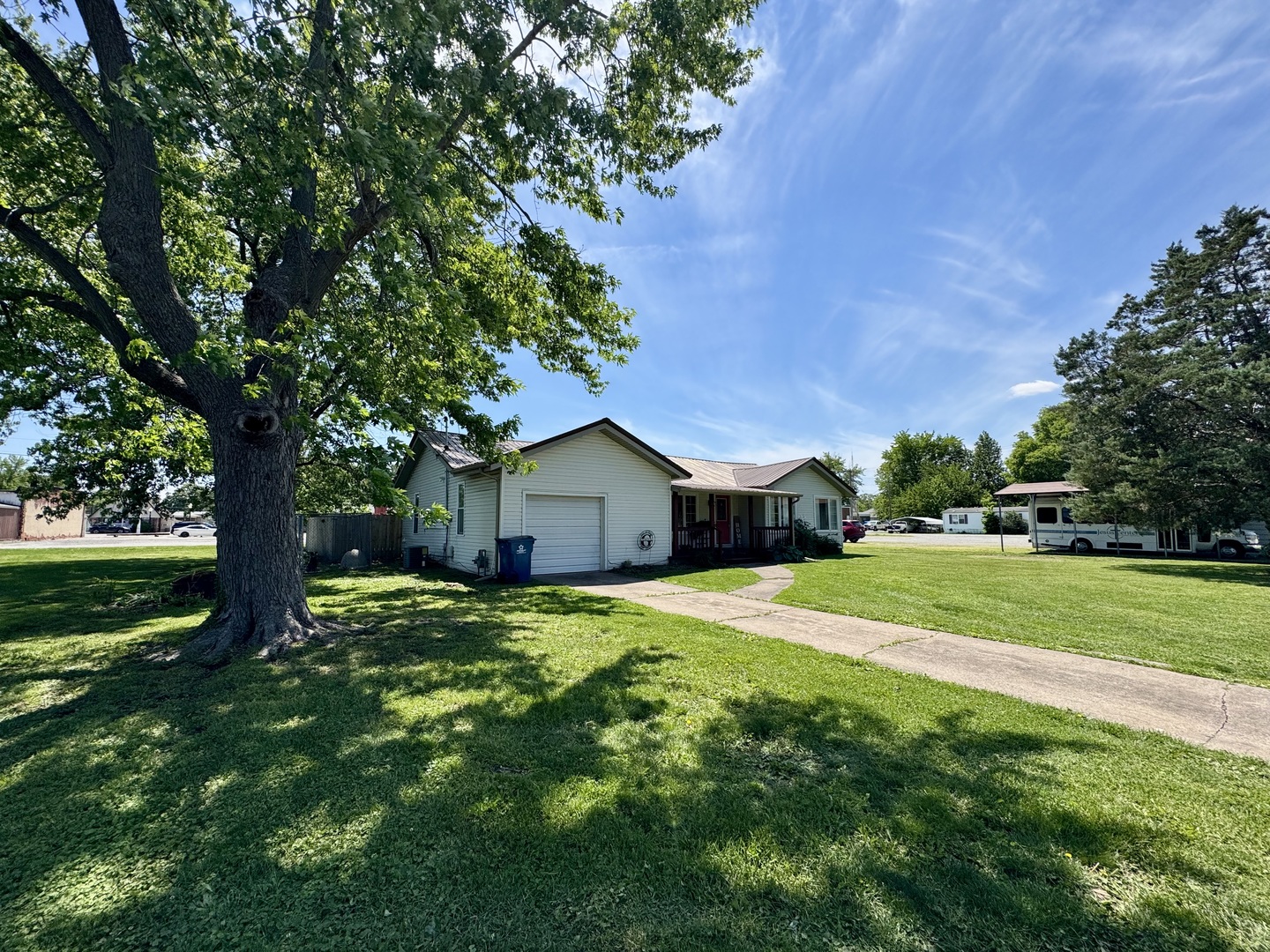 203 West Callie Street Sesser, IL 62884 - Photo 2 of 27 a house view with a garden space