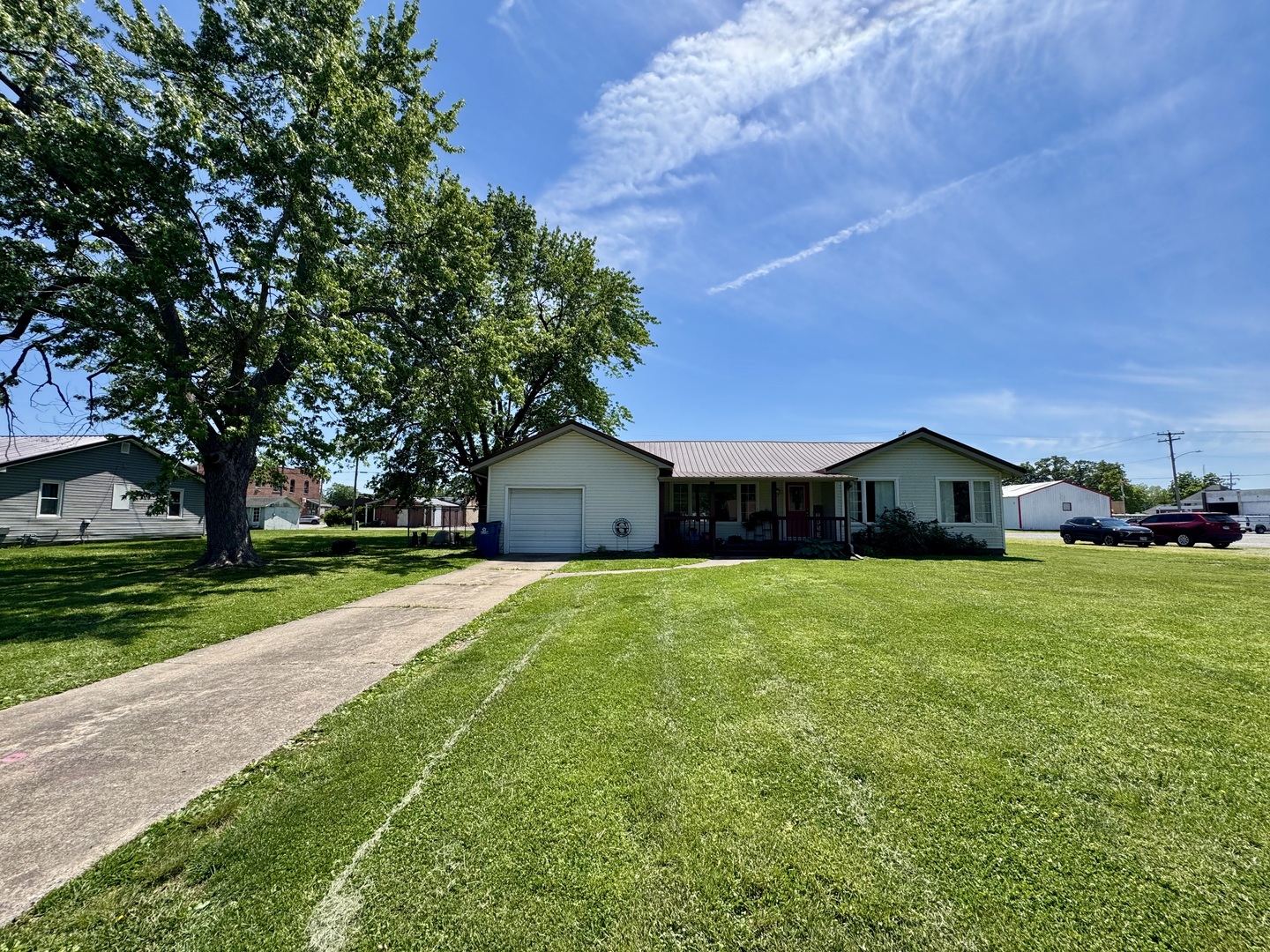 203 West Callie Street Sesser, IL 62884 - Photo 4 of 27 a view of a big yard with plants and large trees