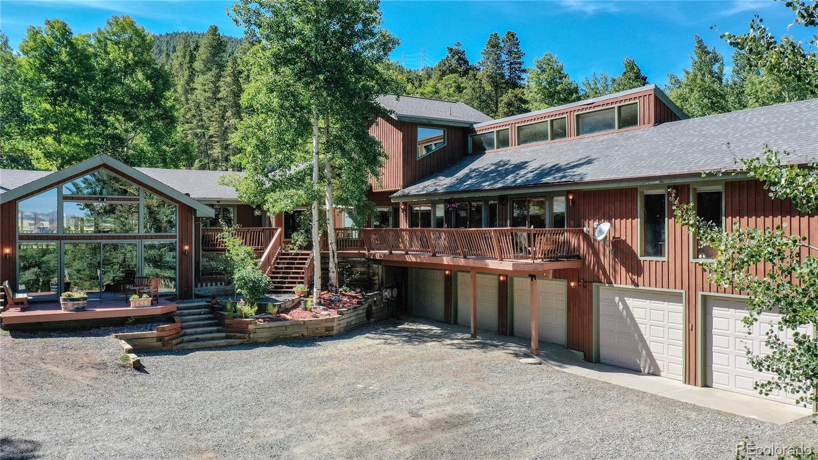 a view of house with outdoor space and sitting area