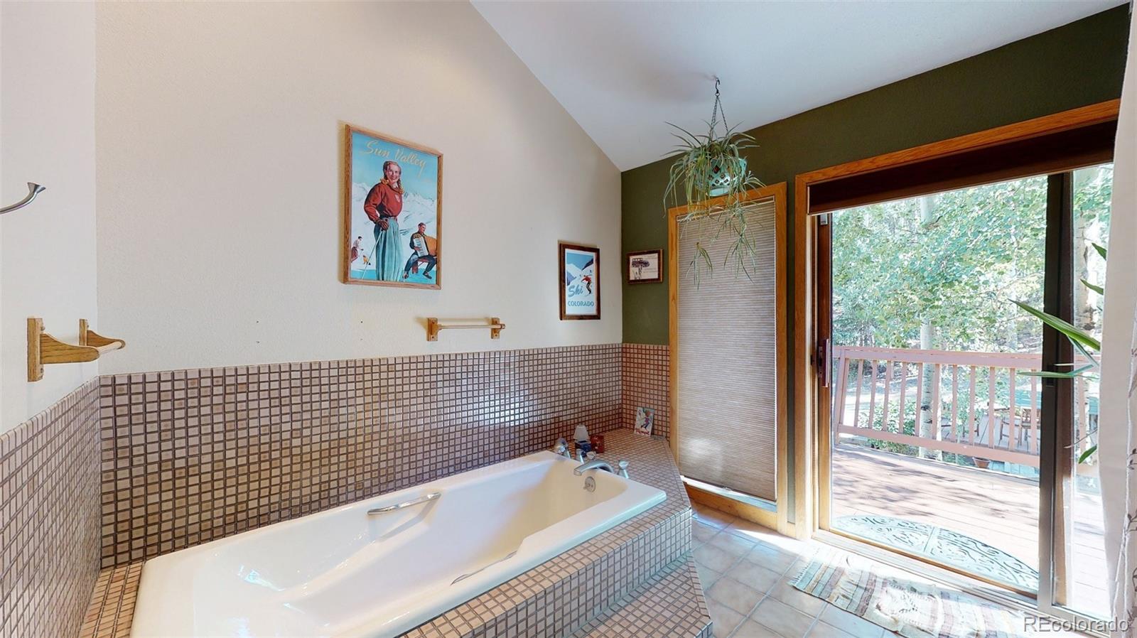 2720 South Spring Gulch Road Idaho Springs, CO 80452 - Photo 20 of 38 a bathroom with a bathtub and shower