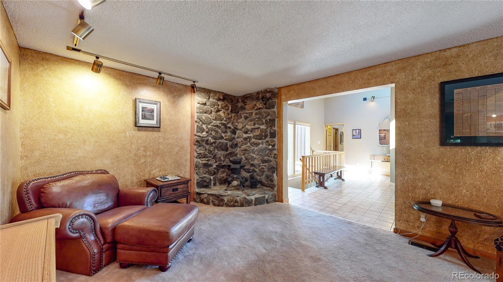 2720 South Spring Gulch Road Idaho Springs, CO 80452 - Photo 2 of 38 a view of a livingroom with lounge chair