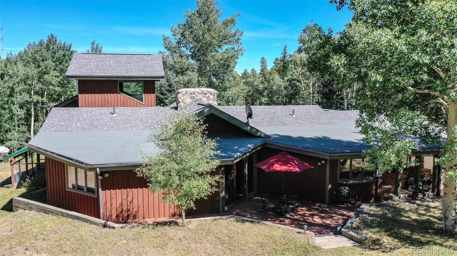 2720 South Spring Gulch Road Idaho Springs, CO 80452 - Photo 32 of 38 a view of a house with yard and sitting area