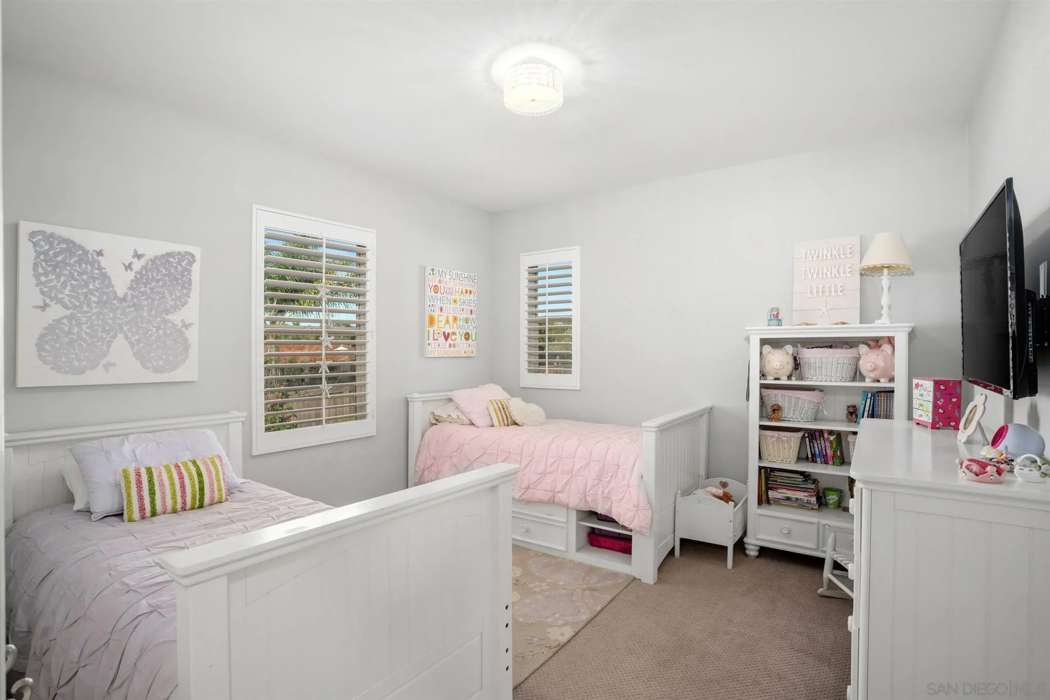 700 Blossom Road Encinitas, CA 92024 - Photo 35 of 50 a bedroom with a bed and a window