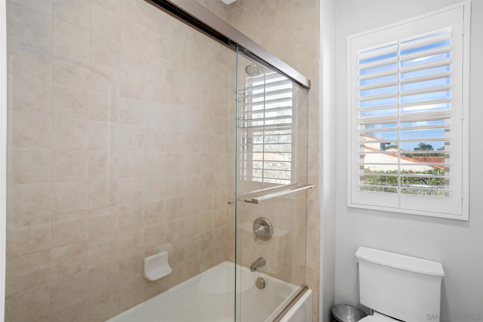 700 Blossom Road Encinitas, CA 92024 - Photo 37 of 50 a bath room with a toilet a bath tub and a shower