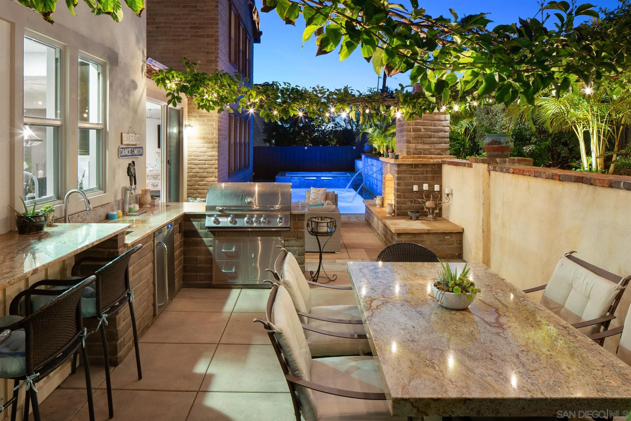 700 Blossom Road Encinitas, CA 92024 - Photo 4 of 50 a kitchen with a sink and cabinets