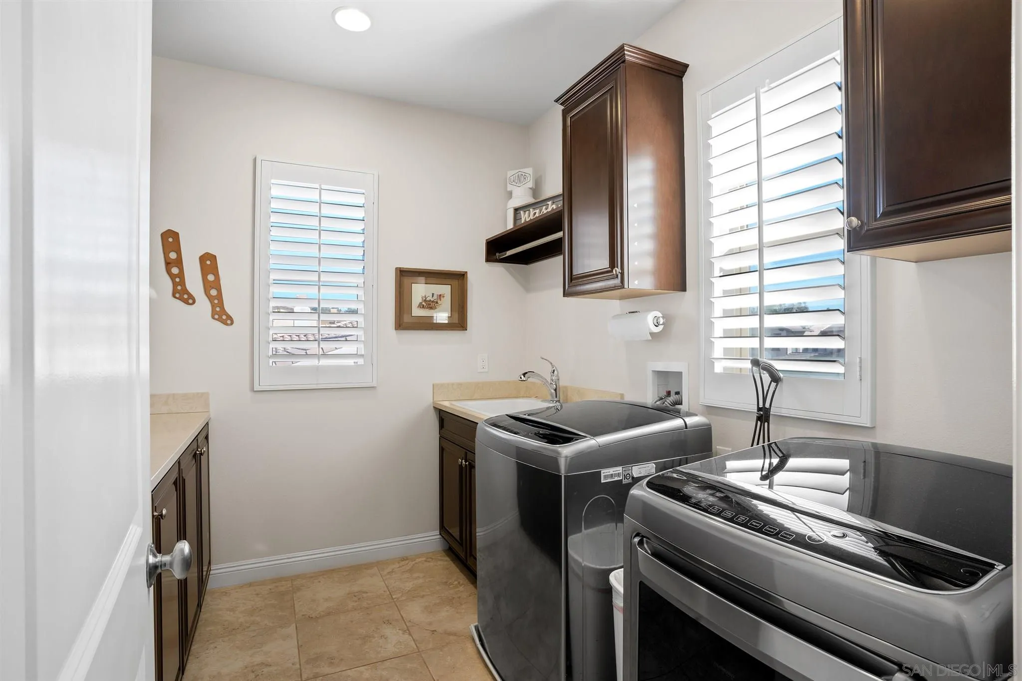 700 Blossom Road Encinitas, CA 92024 - Photo 44 of 50 a kitchen with a stove and a sink