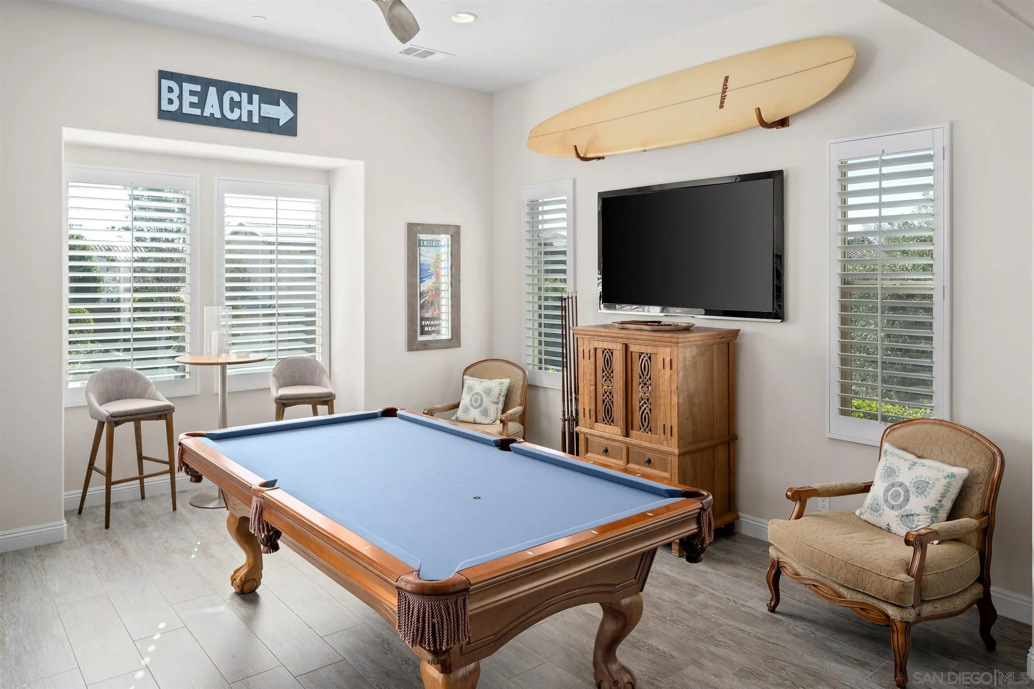 700 Blossom Road Encinitas, CA 92024 - Photo 45 of 50 a room with furniture pool table flat screen tv and windows
