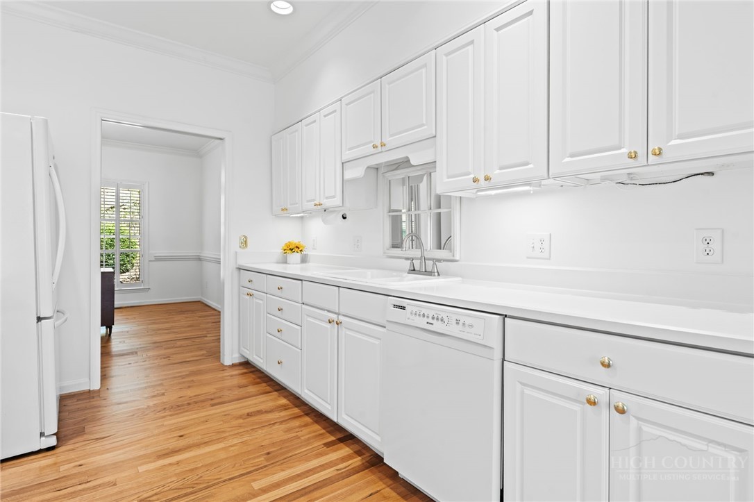 480 North Ridge Circle Boone, NC 28607 - Photo 12 of 50 a kitchen with stainless steel appliances white cabinets and a refrigerator