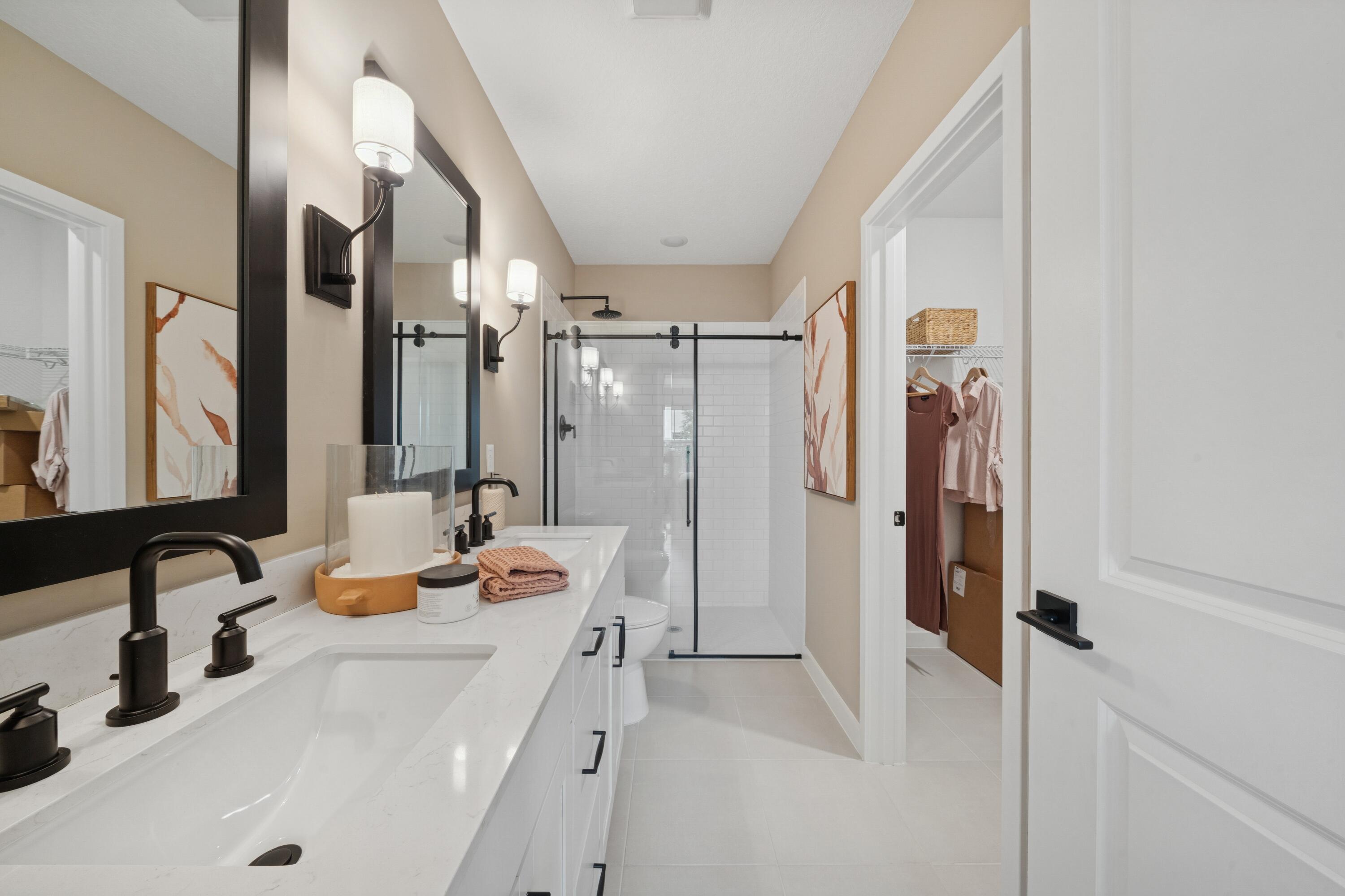 9736 Apollo Avenue, Unit 3 Fort Pierce, FL 34945 - Photo 33 of 39 a bathroom with a tub sink and mirror