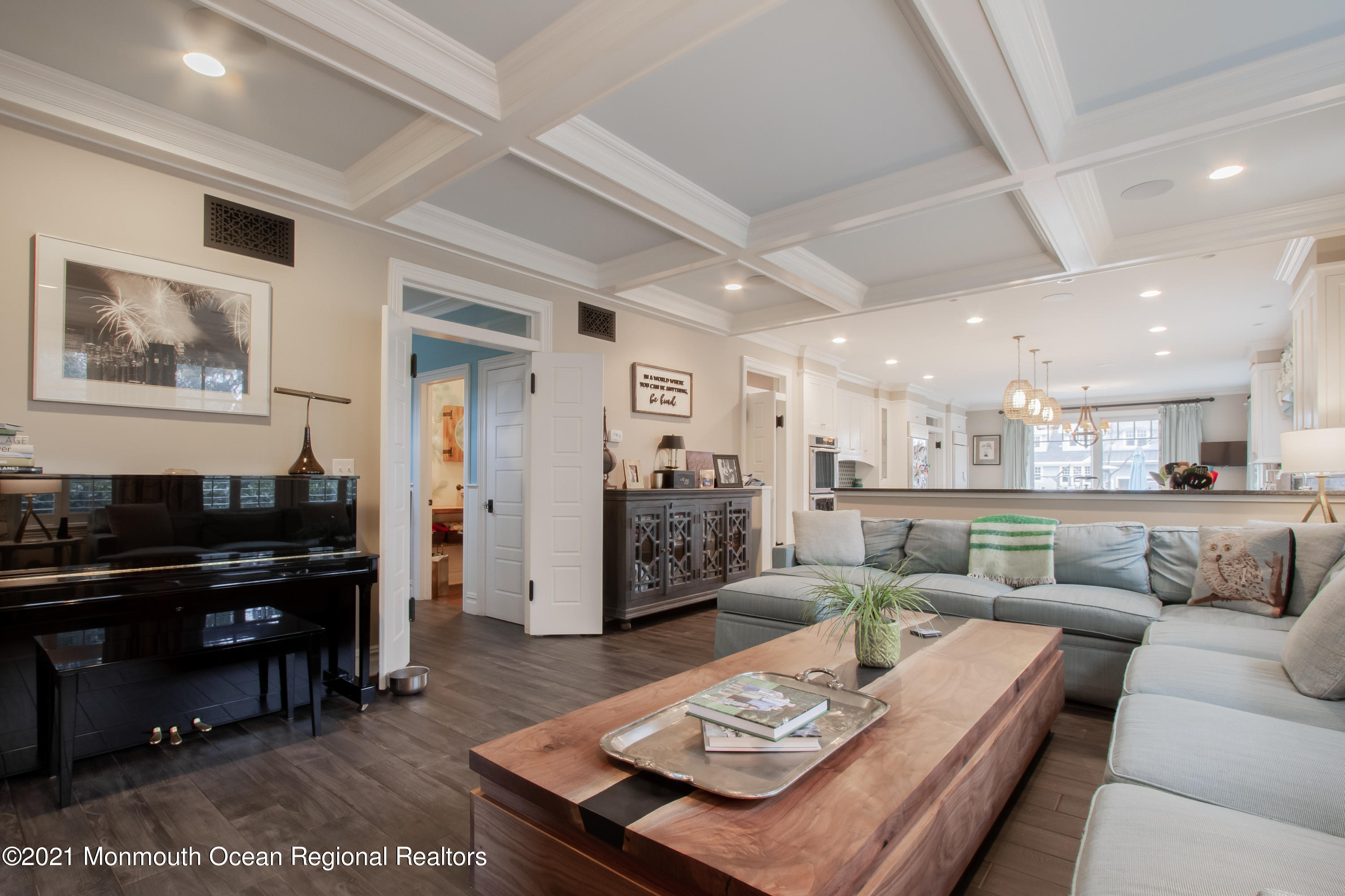 451 Little Silver Point Road Little Silver, NJ 07739 - Photo 13 of 63 a living room with furniture and a dining table with kitchen view